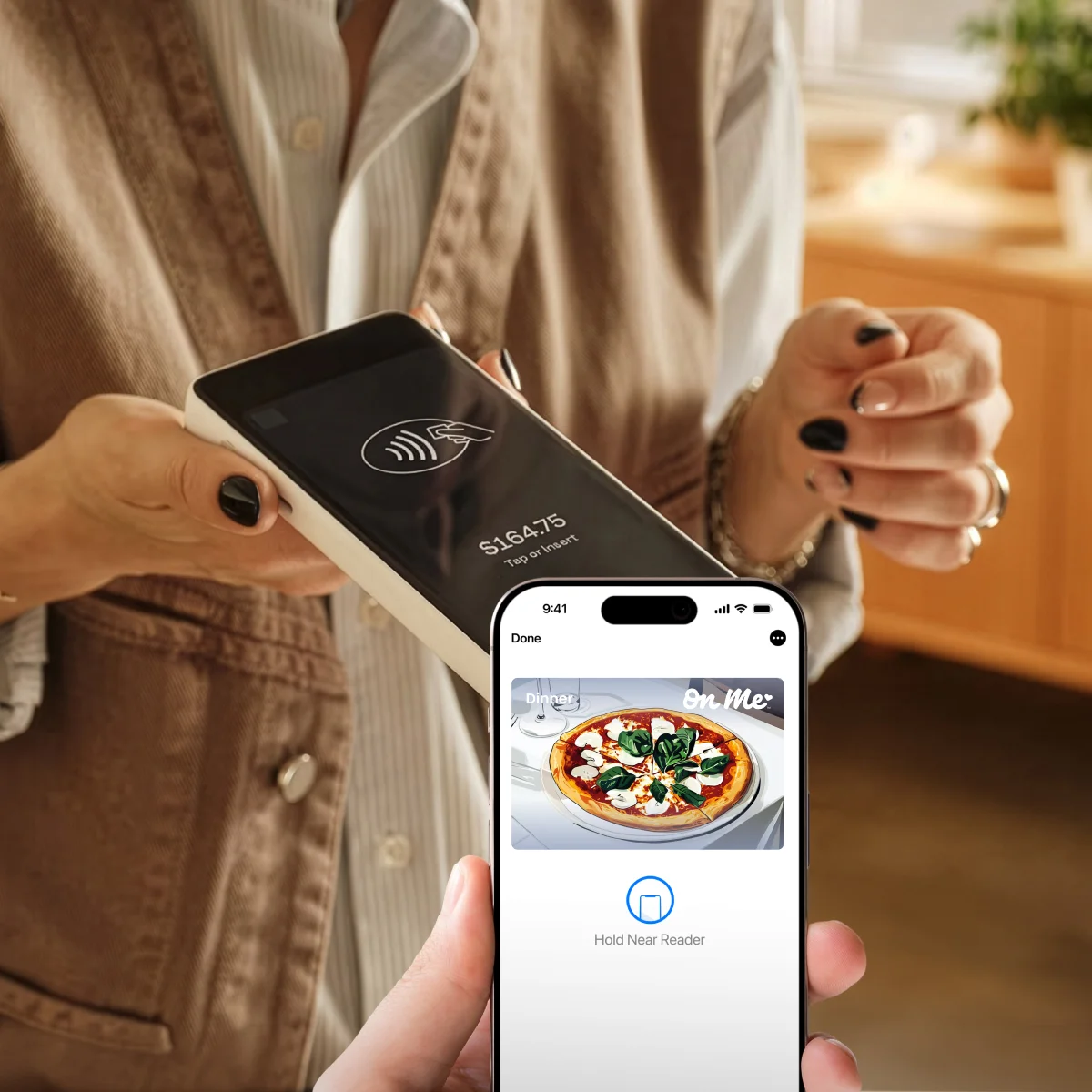 On Me card being tapped to pay in a store